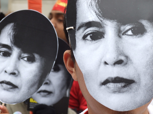 People in Aung San Suu Kyi masks by lewishamdreamer from Flickr used under 